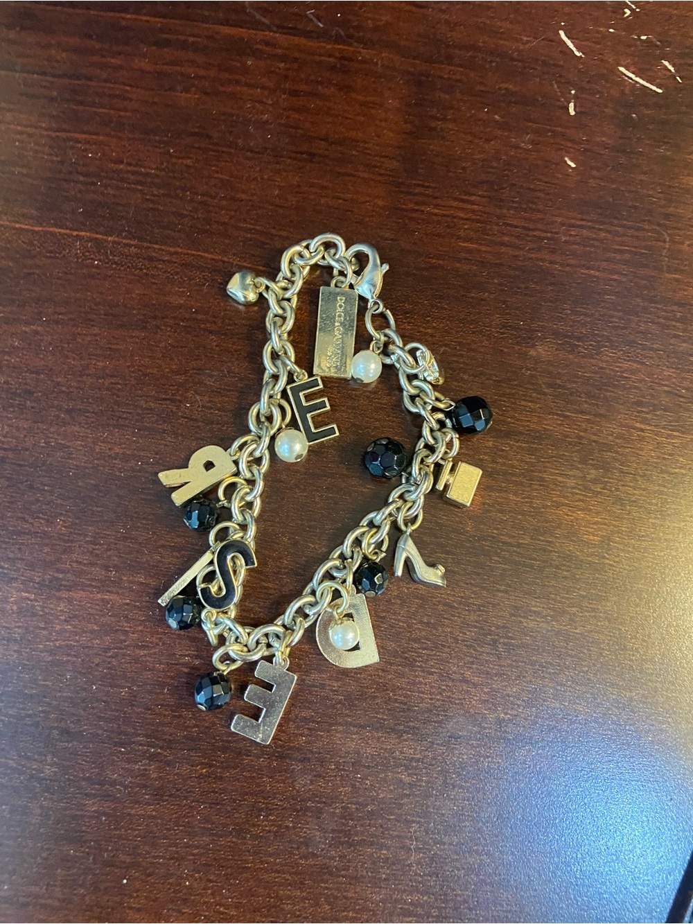 Dolce and Gabana Desire charm bracelet with black and pearl accents